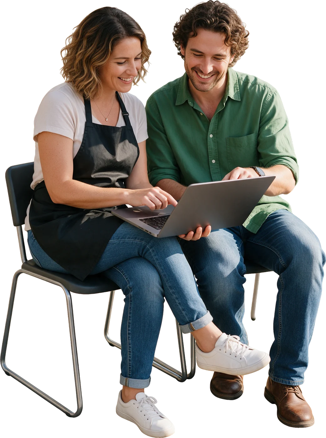 A salon owner and a consultant working through a laptop together